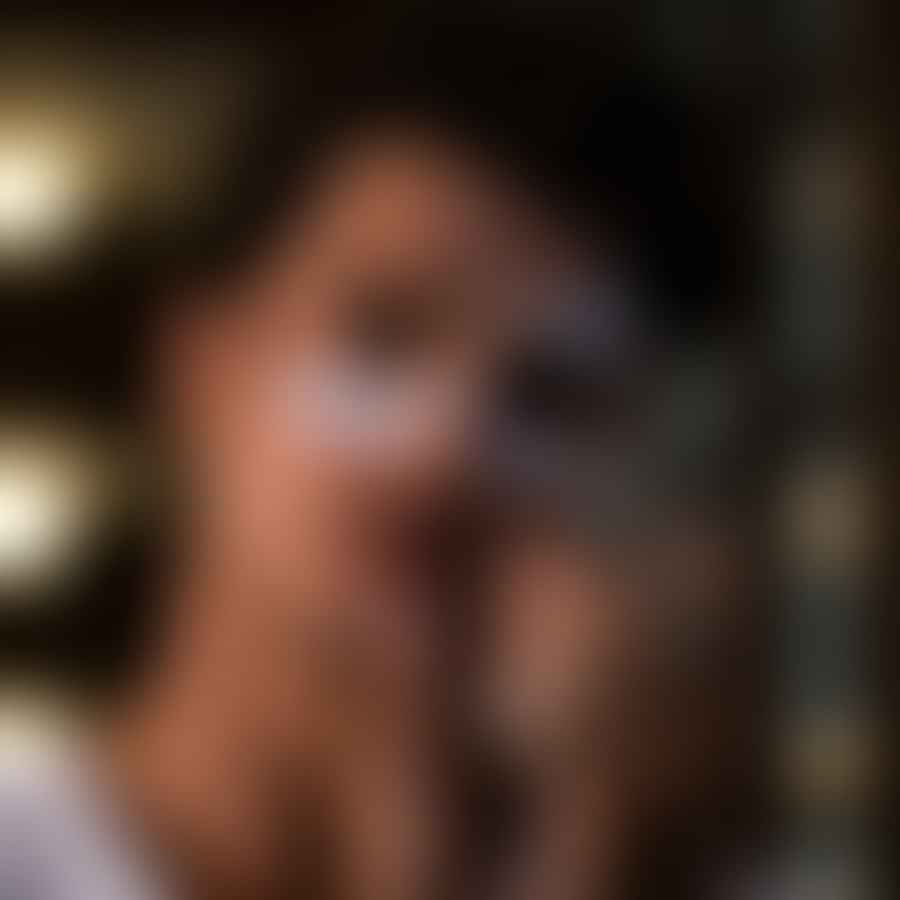 Male beauty blogger applying skincare product