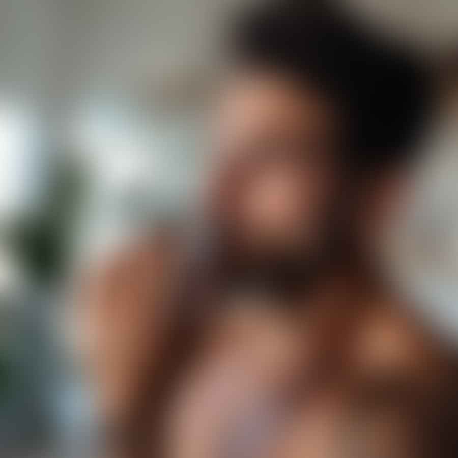 Male beauty blogger applying skincare product