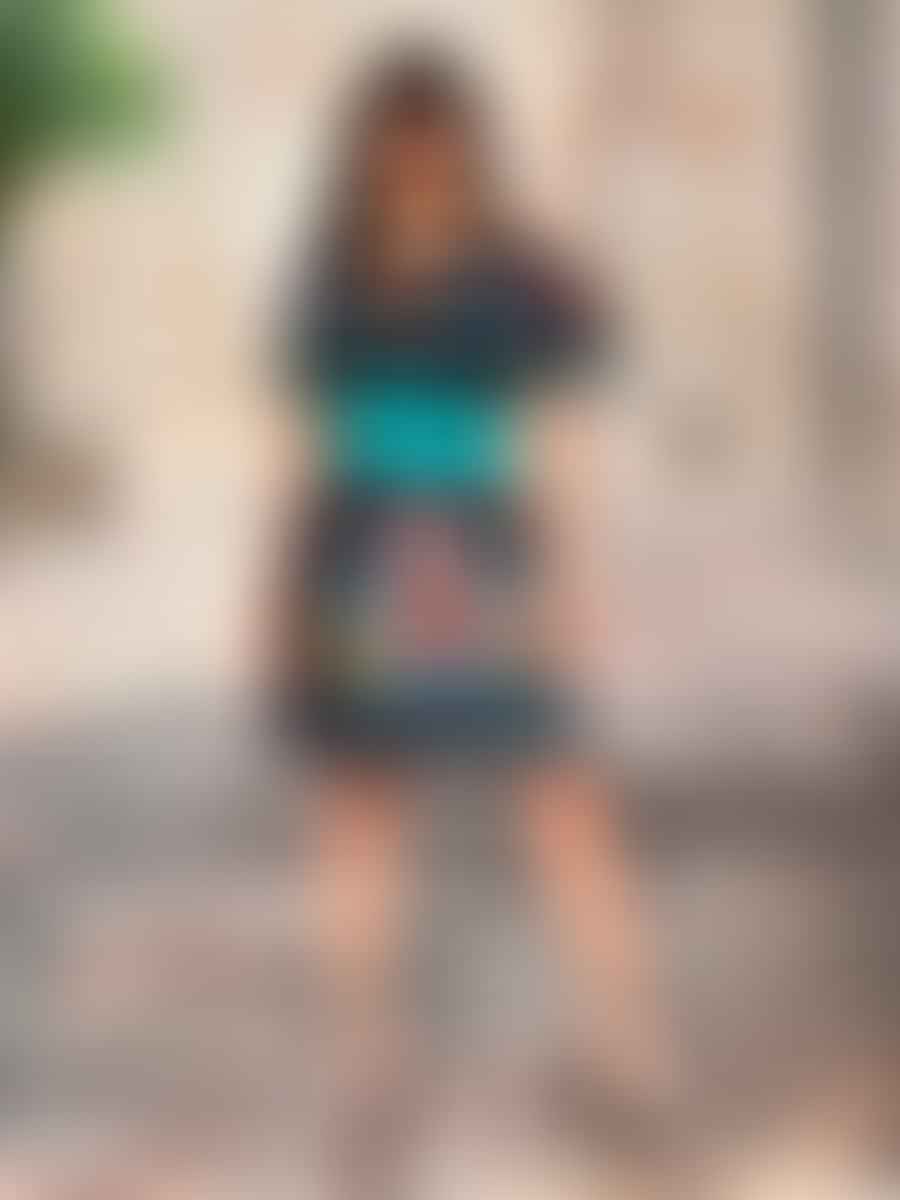 Latina fashion blogger posing in a vibrant outfit
